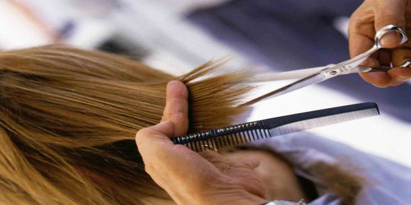 Image of someone cutting a person's hair.