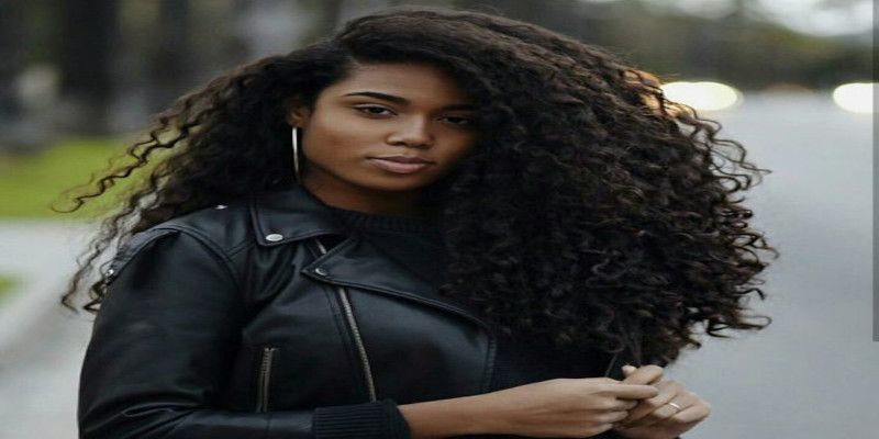 Image of a dark skinned woman with thick, coarse hair.